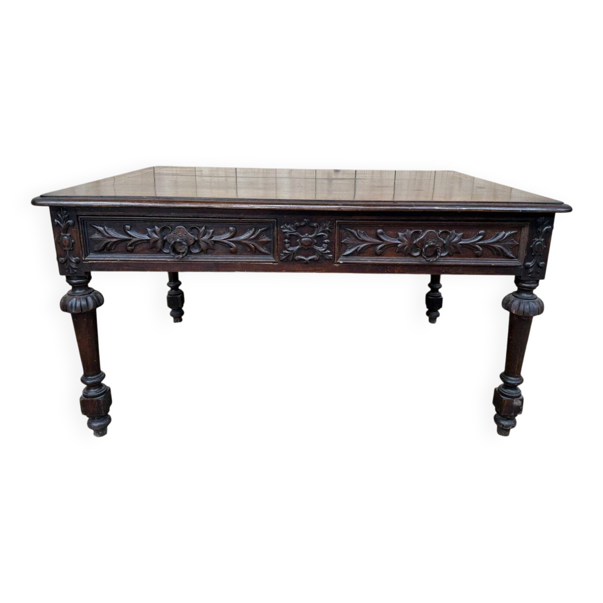 Middle table in a sculpted Louis XIII style living room.