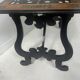 Blackened wood display table with marquetry top, Spain, 19th century.