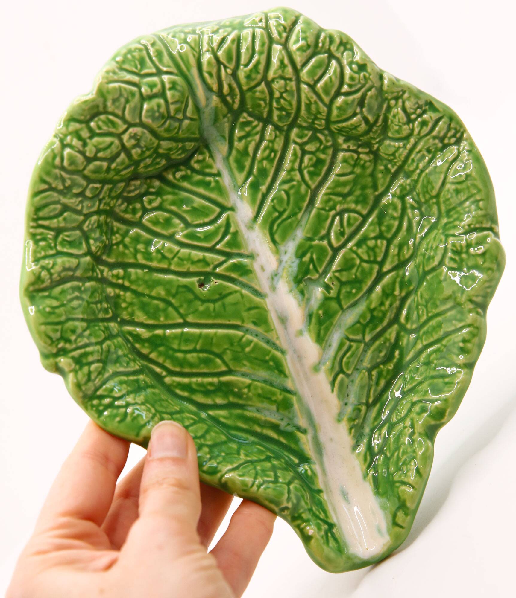Trompe l'oeil cup bright green cabbage leaf in slip