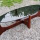 Designer coffee table by Hugues Poignant in rosewood and smoked glass from the 70s