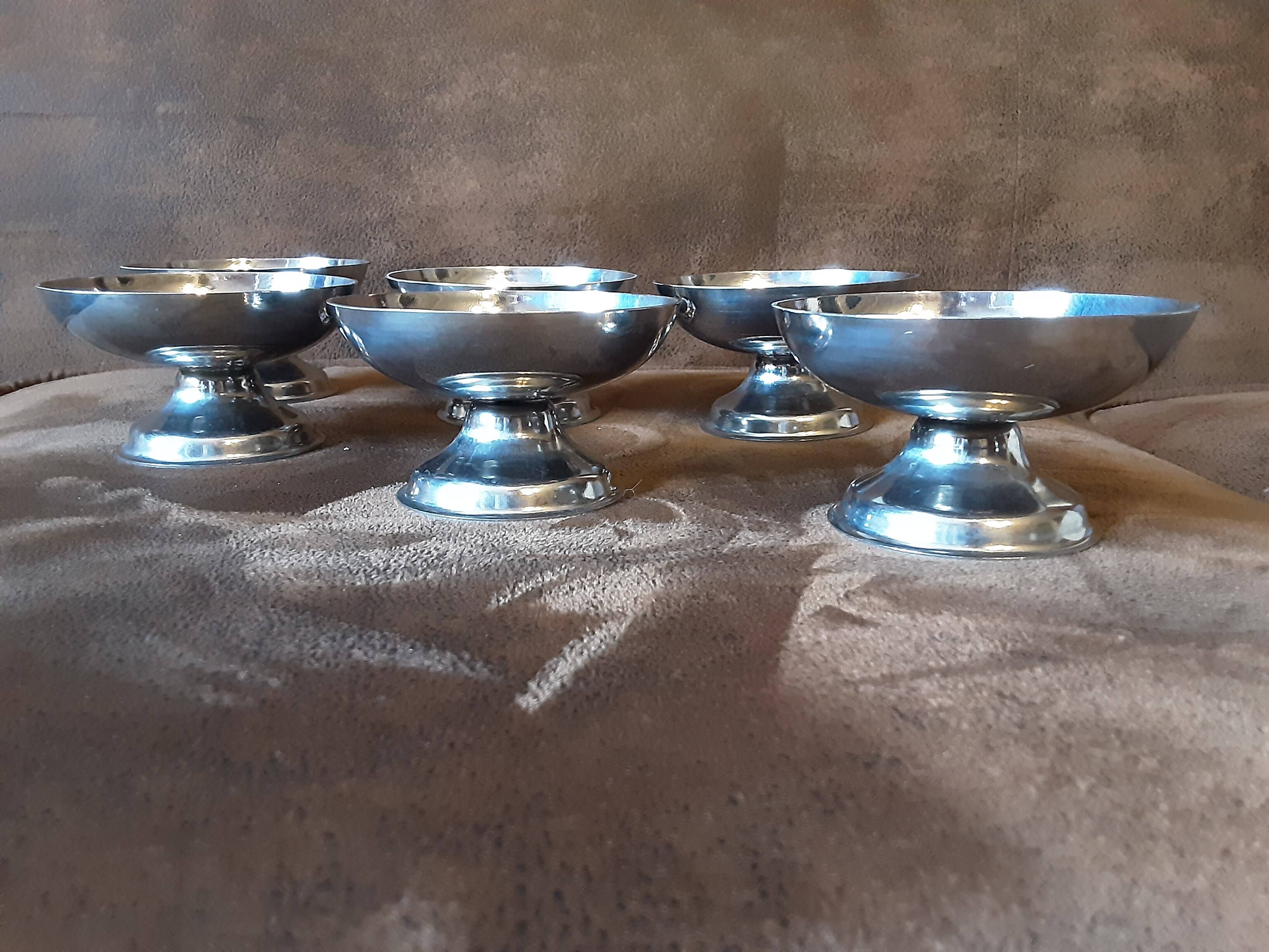Set of 6 footed bowls. Metal