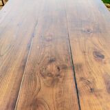 Old French farmhouse table in walnut with turned legs.