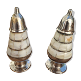 Antique salt and pepper shakers in mother-of-pearl.