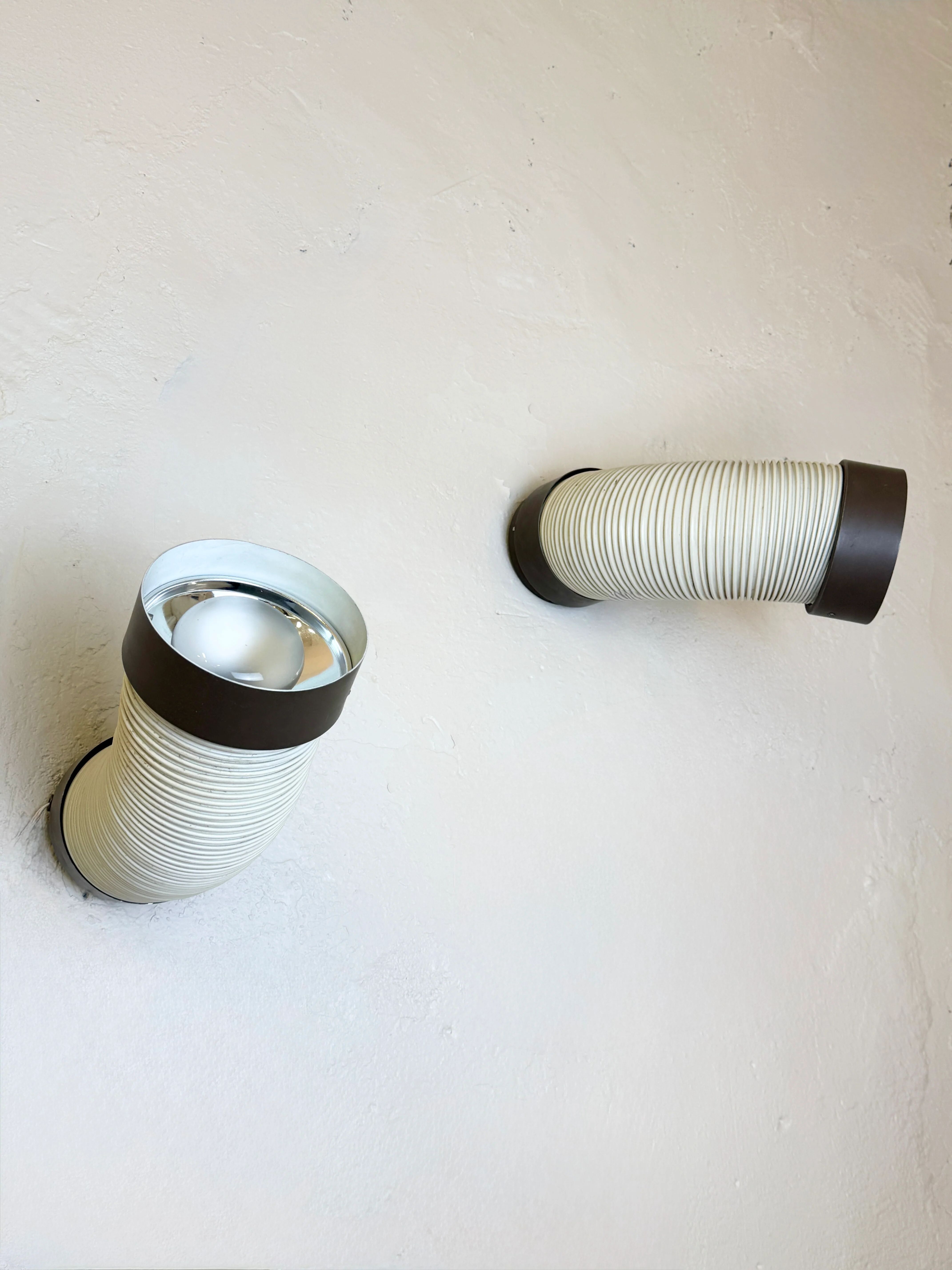Pair of adjustable wall lights "Tuyau" by Raak, 1970s