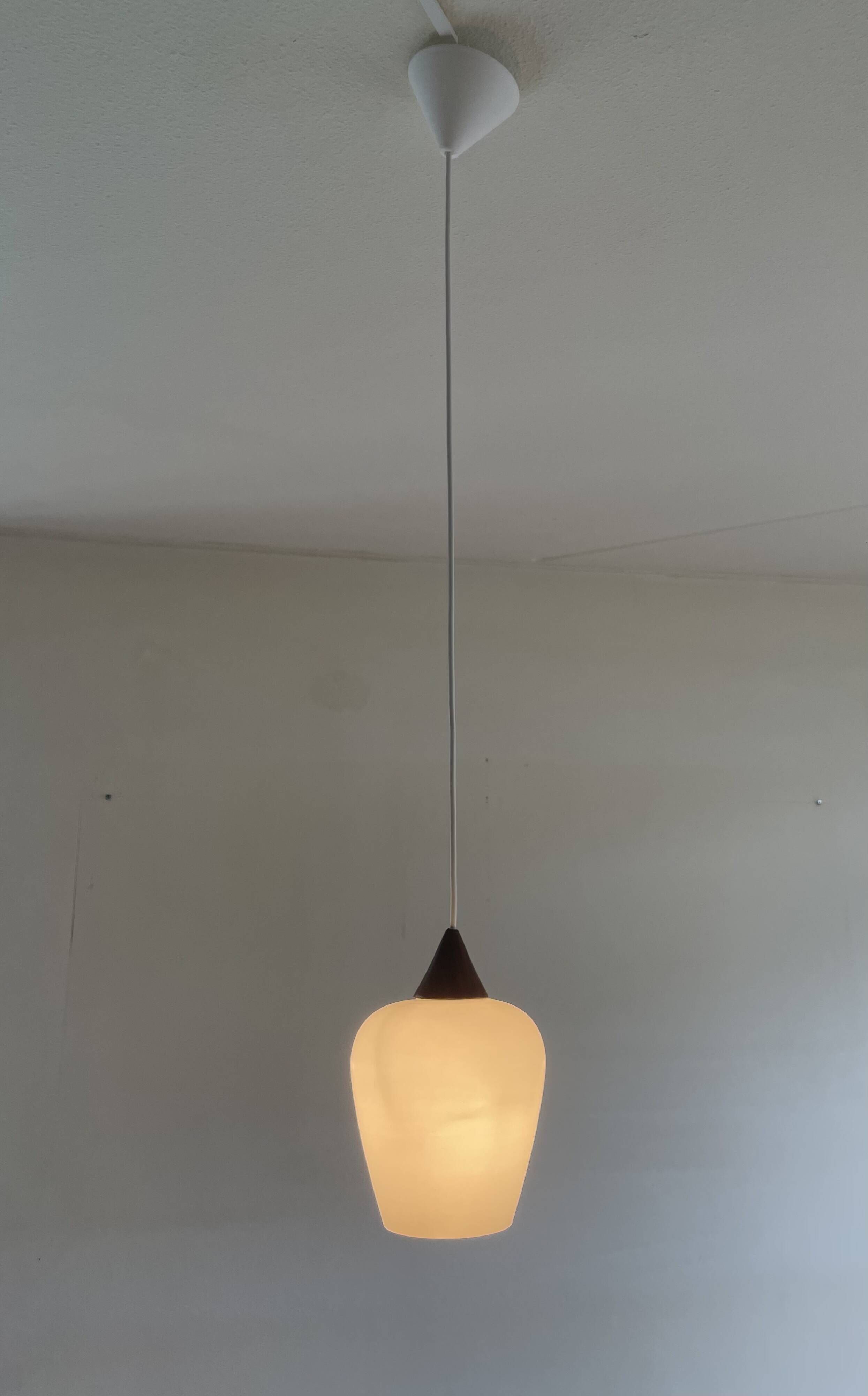 Danish teak and milk glass pendant lamp.