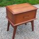 Vintage bedside table with compass legs from the 50s