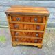 Small English chest of drawers with a folding top.