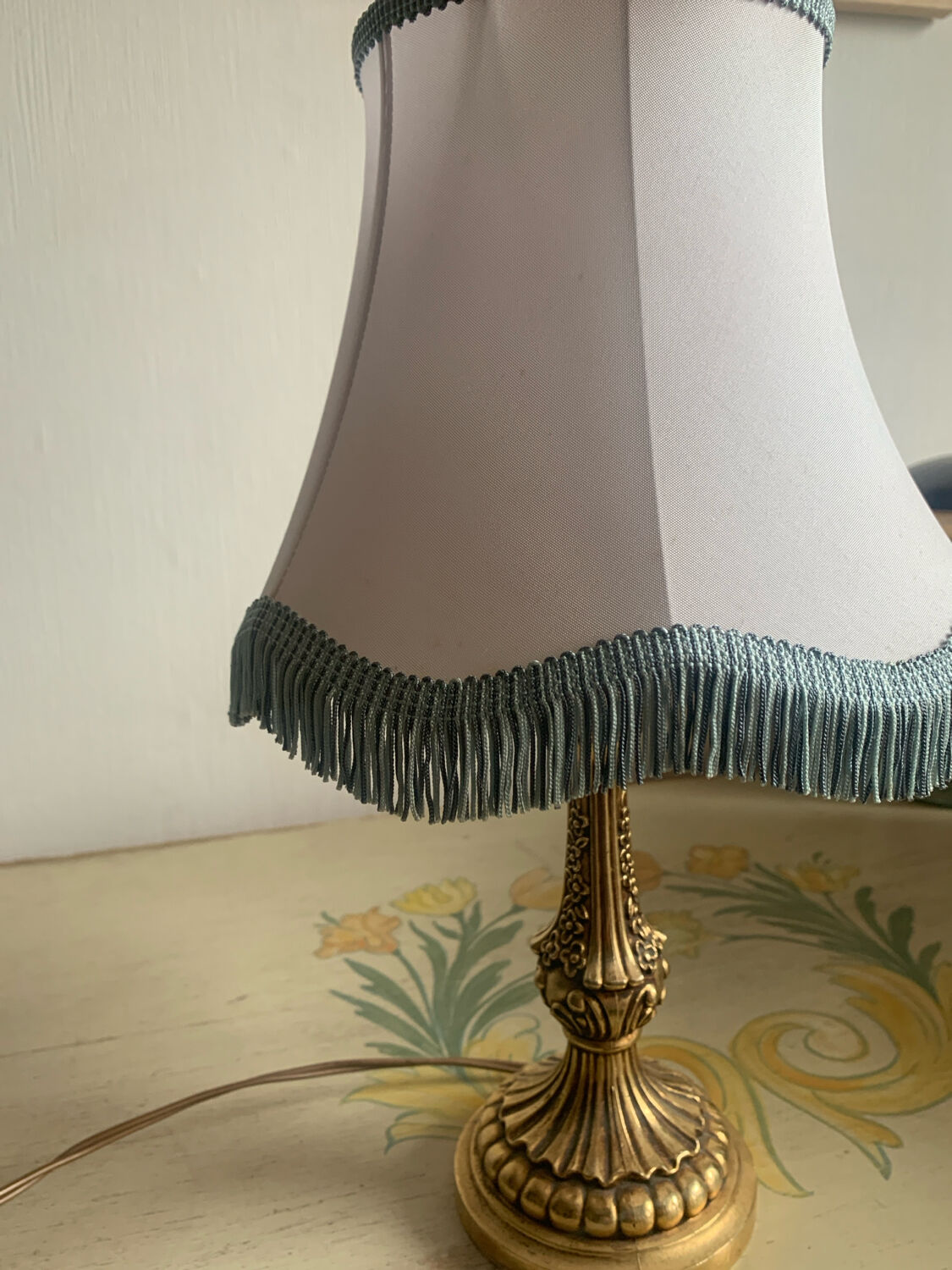 Vintage Neo-Rococo bedside lamp with fringed shade.