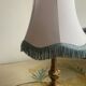 Vintage Neo-Rococo bedside lamp with fringed shade.
