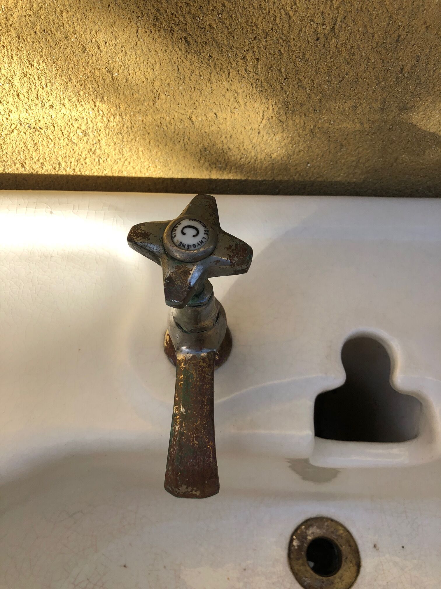 Antique washbasin on ceramic column