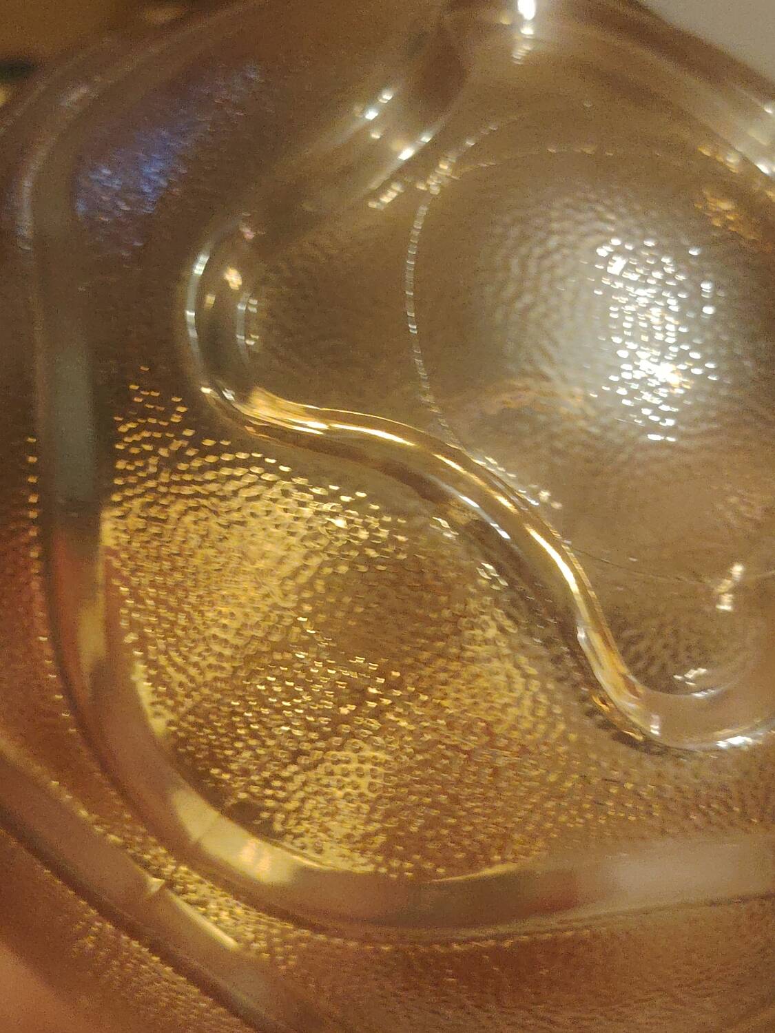 Textured amber globe wall light