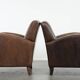 Elegant set of two sheepskin leather armchairs with beautiful round shapes