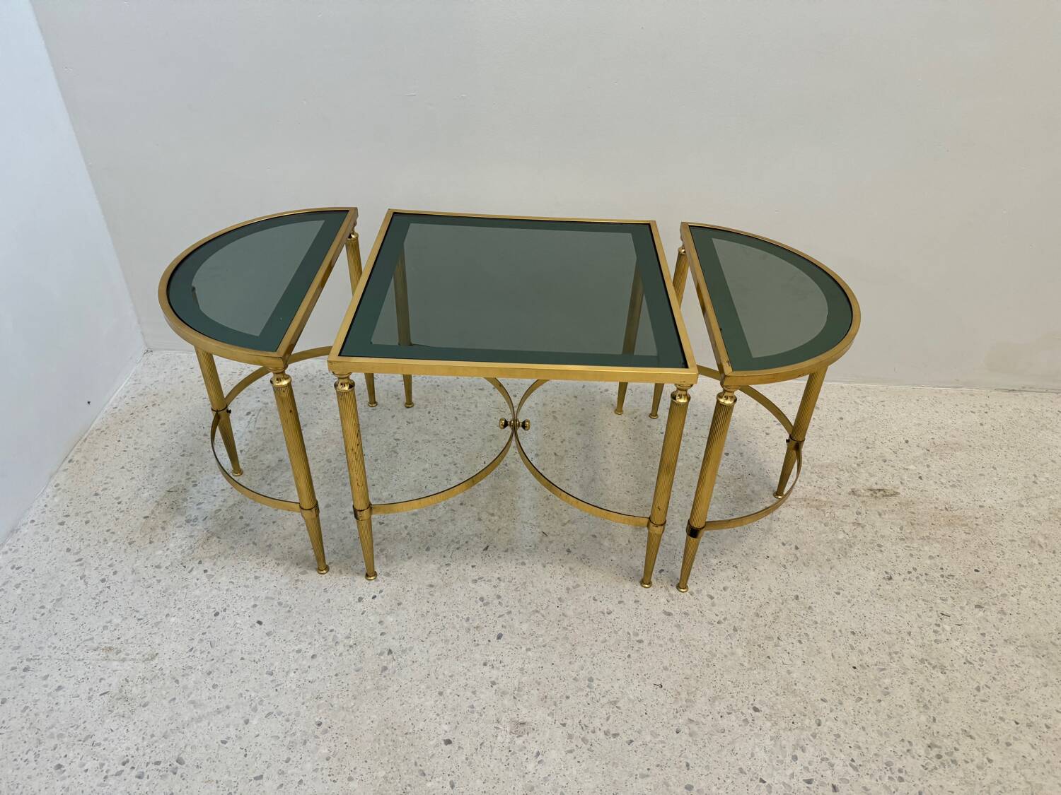 Neo classic coffee table in brass and smoked glass
