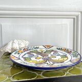 Decorative ceramic plate with griffins