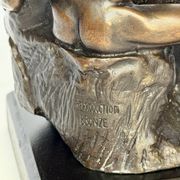 The bronze sculpture The Kiss, a reproduction of Rodin's statue, French sculpture.