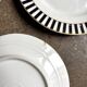 4 dessert plates in white, black and gold Limoges porcelain