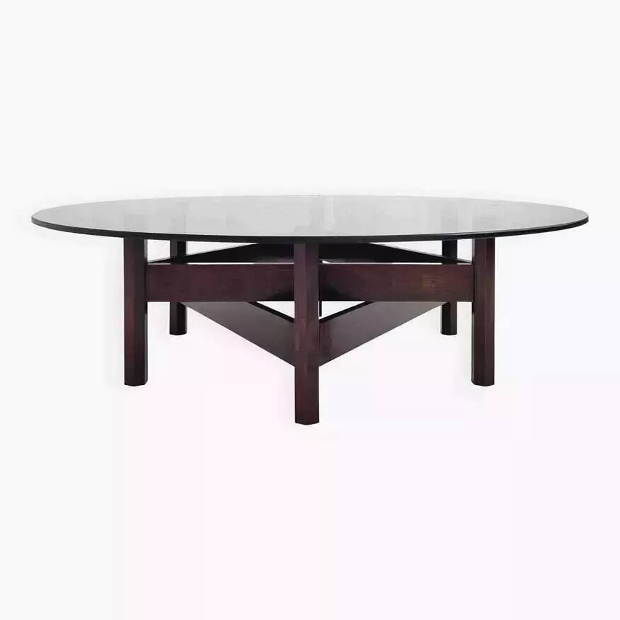 Wooden coffee table with round smoked glass top