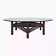 Wooden coffee table with round smoked glass top