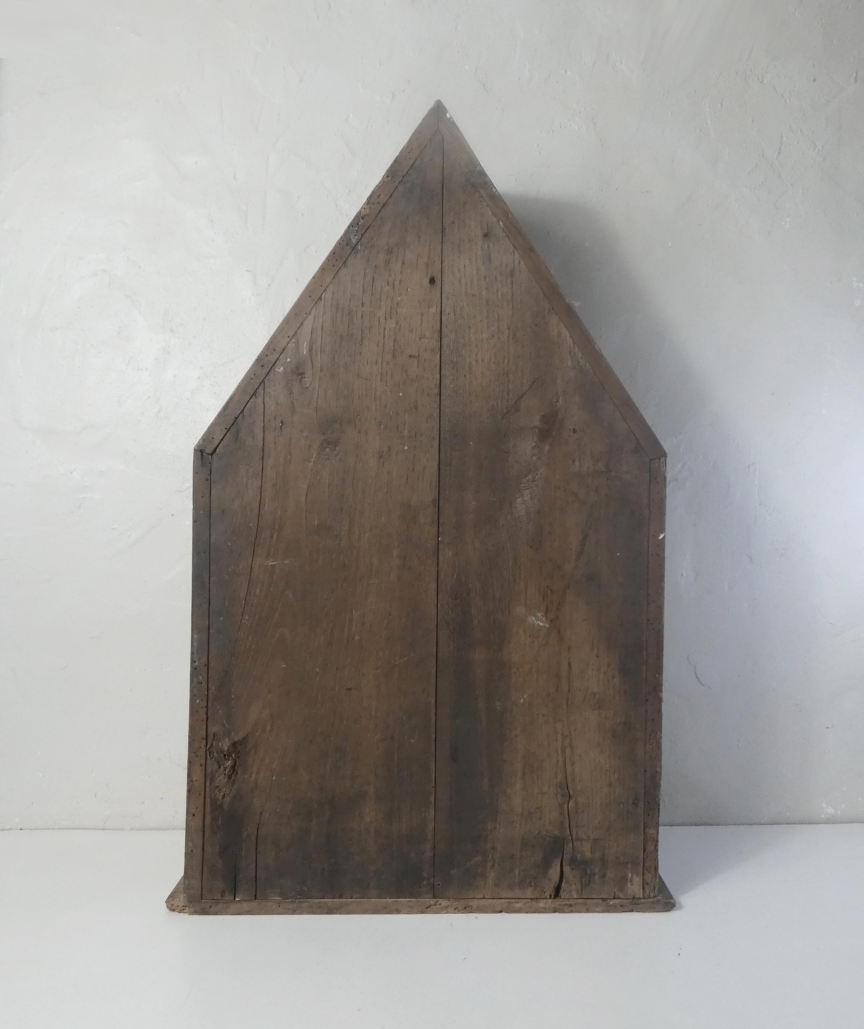 Old niche shelf with glazed statue