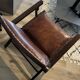 Armchair in wood and leather