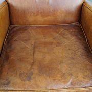 Characteristic sheepskin design armchair in beautiful warm cognac colours