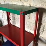 Shelf on multi-colored metal feet