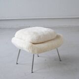 Womb Chair and Ottoman in fluffy white fabric by Eero Saarinen