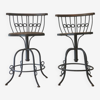 Pair of mid century wrought iron and teak ornate swivel garden chairs