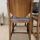Set of four vintage wooden dining chairs with black leather upholstery, 85 × 45 × 45 cm
