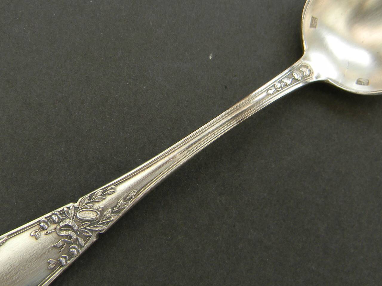 Set of 11 SFAM silver metal teaspoons.