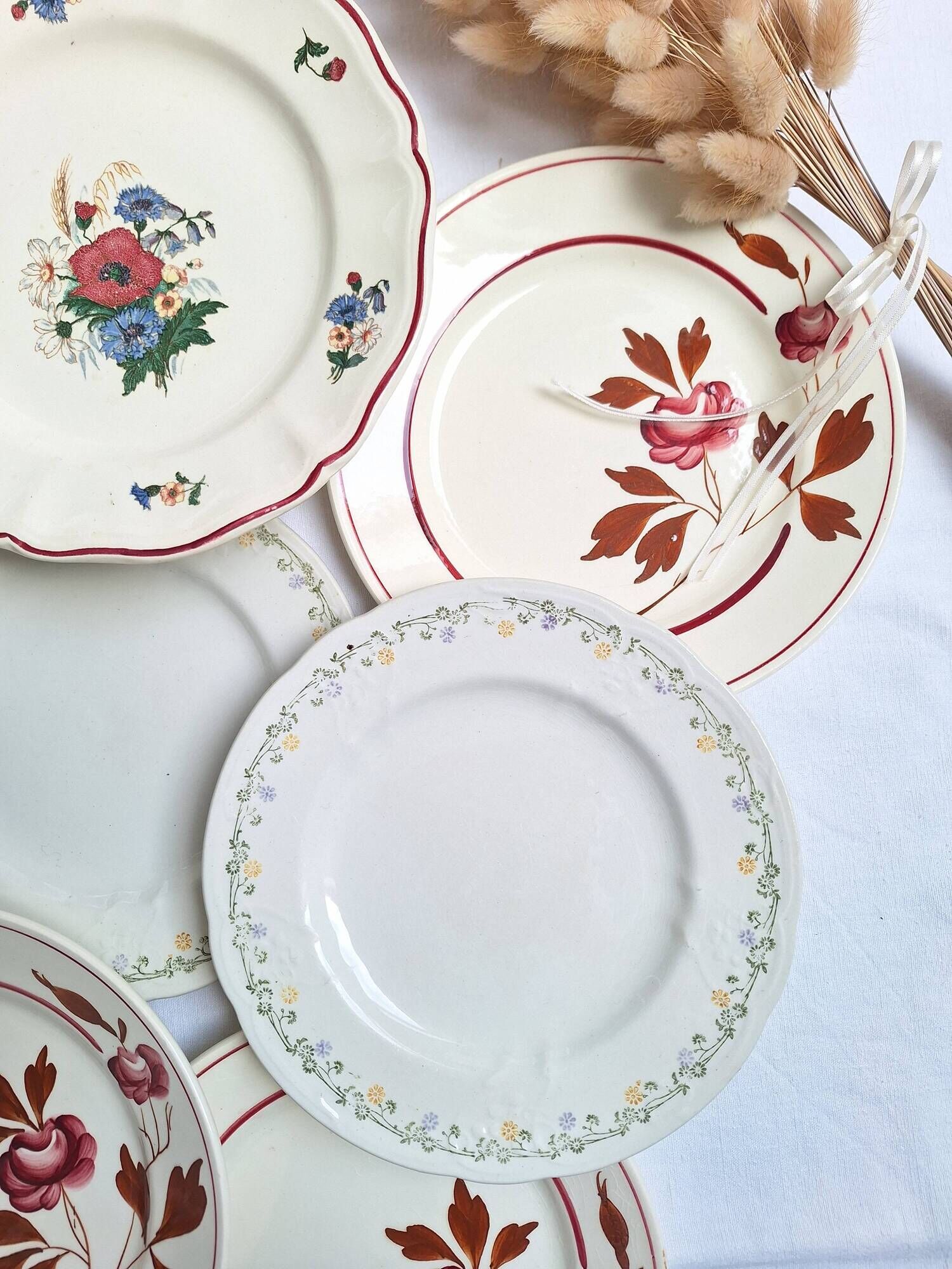 Vintage flower dessert plates from Sarreguemines, Longwy, and Lunéville.
