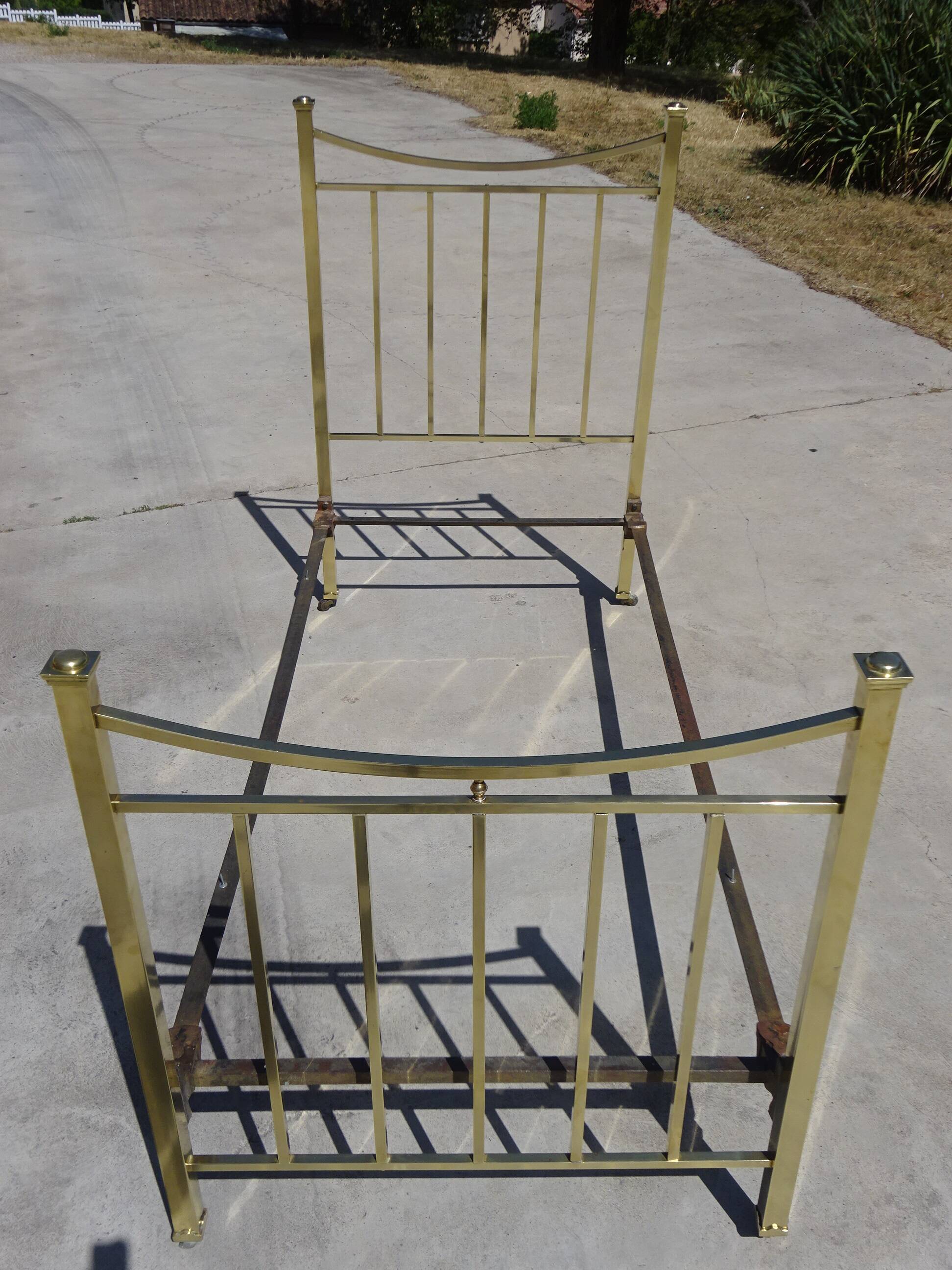 Antique gold-plated brass bed for one person.