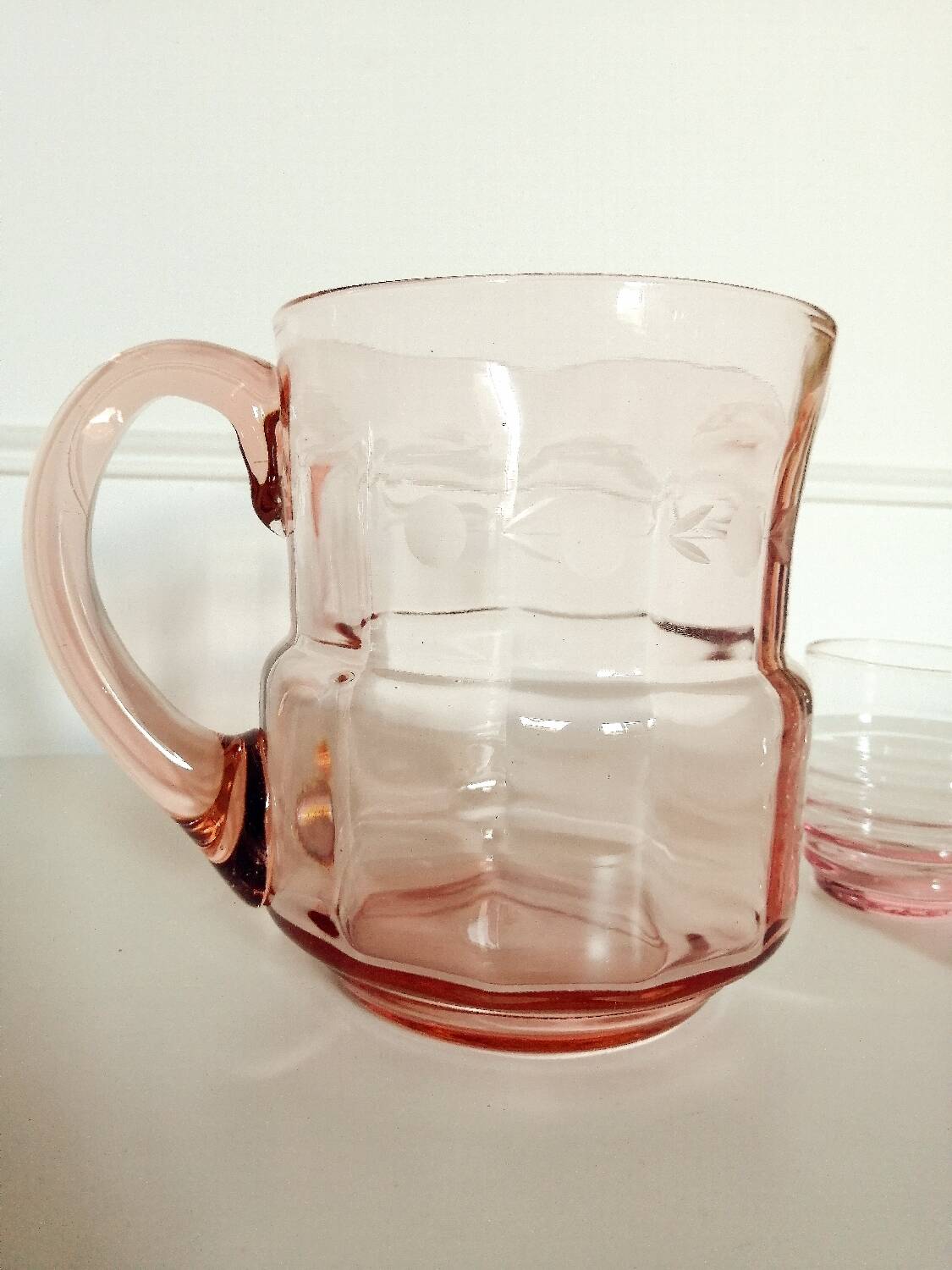 Pitcher and 2 glasses in pink glass