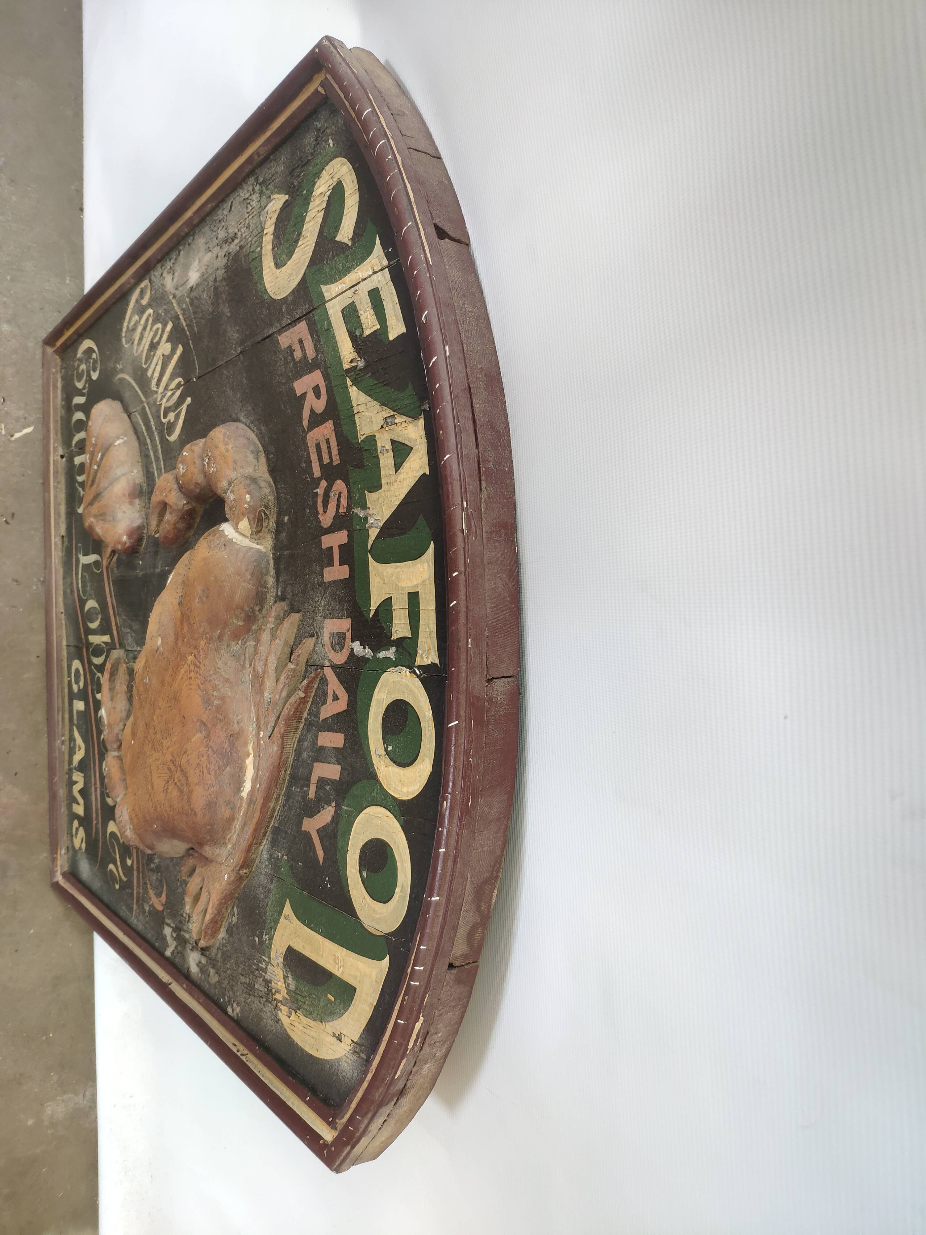 Former Seafood restaurant sign in rare relief