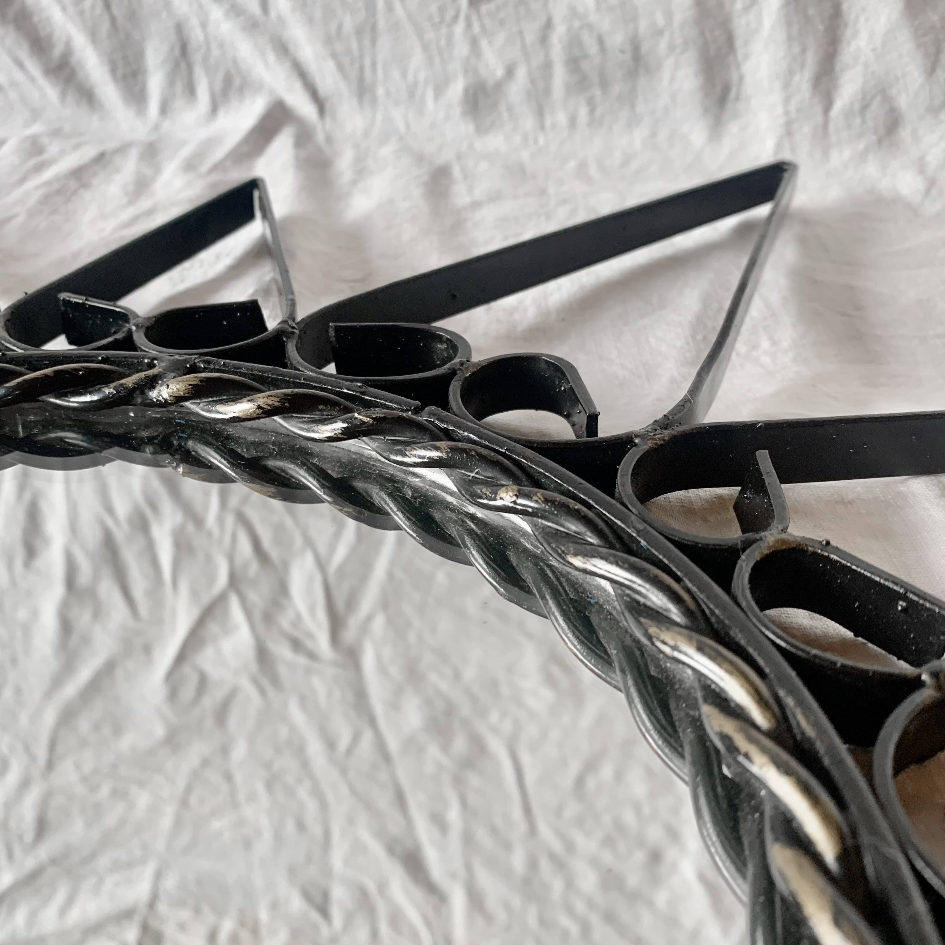 Old wrought metal sun mirror