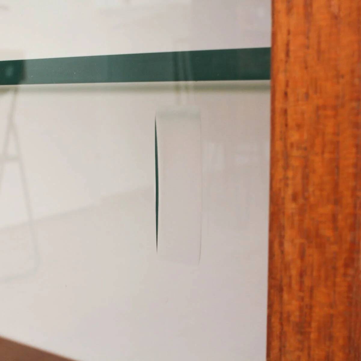 Teak display cabinet with black hairpin legs.