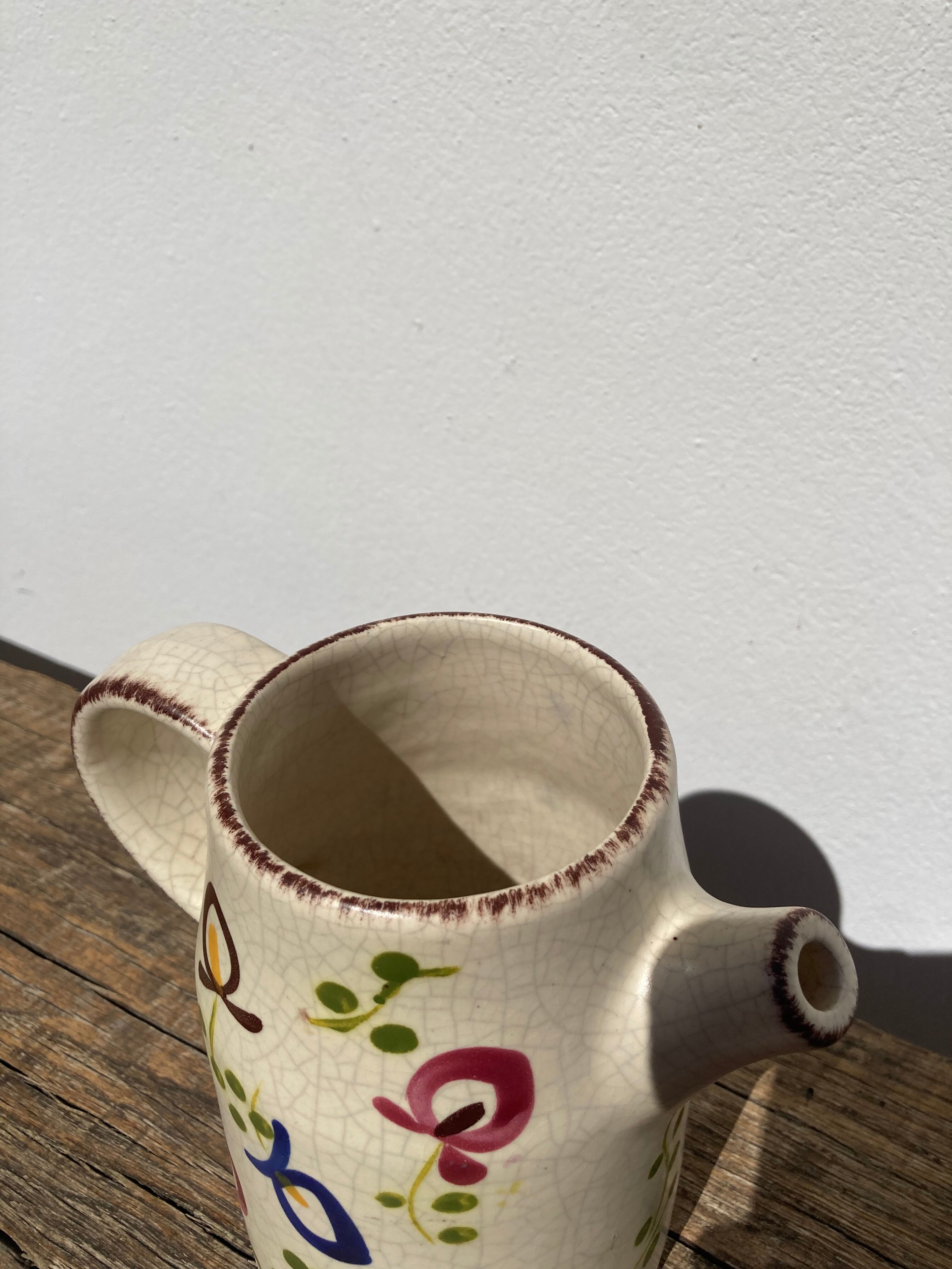 Ceramic water pitcher decorated with flowers