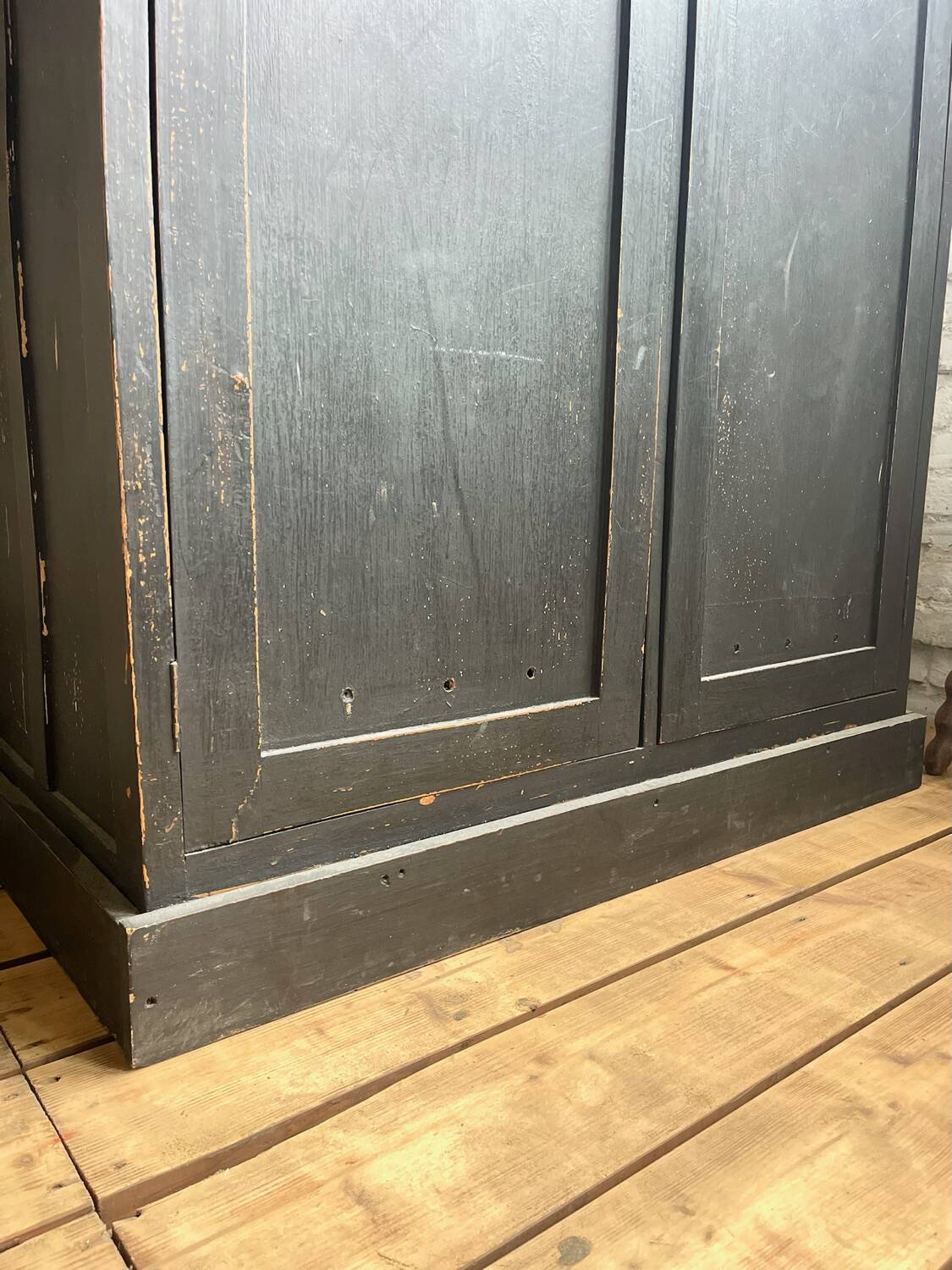 Old wooden locker with black patina