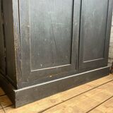 Old wooden locker with black patina