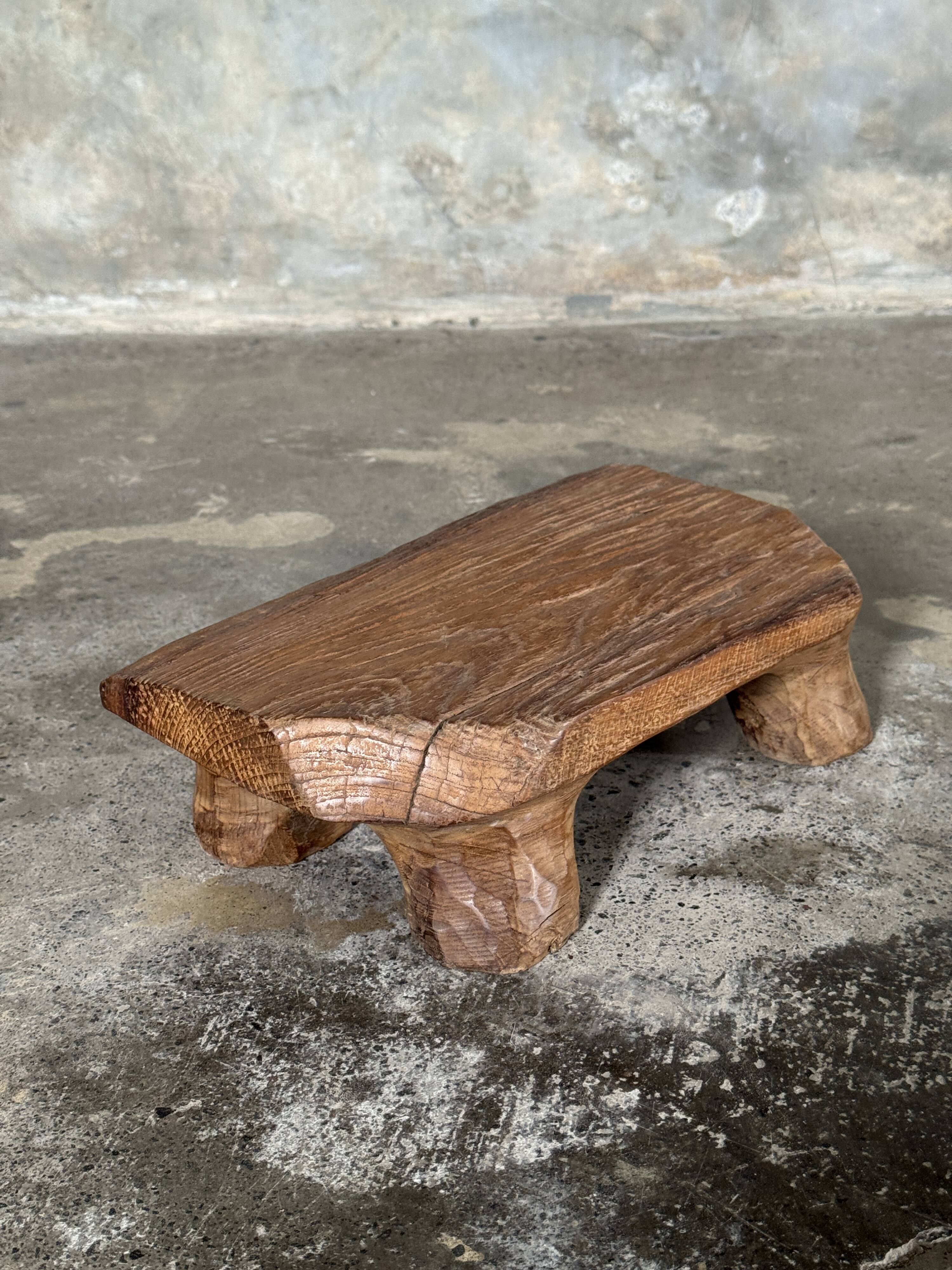 Small stool, teak footrest with short cut corners.