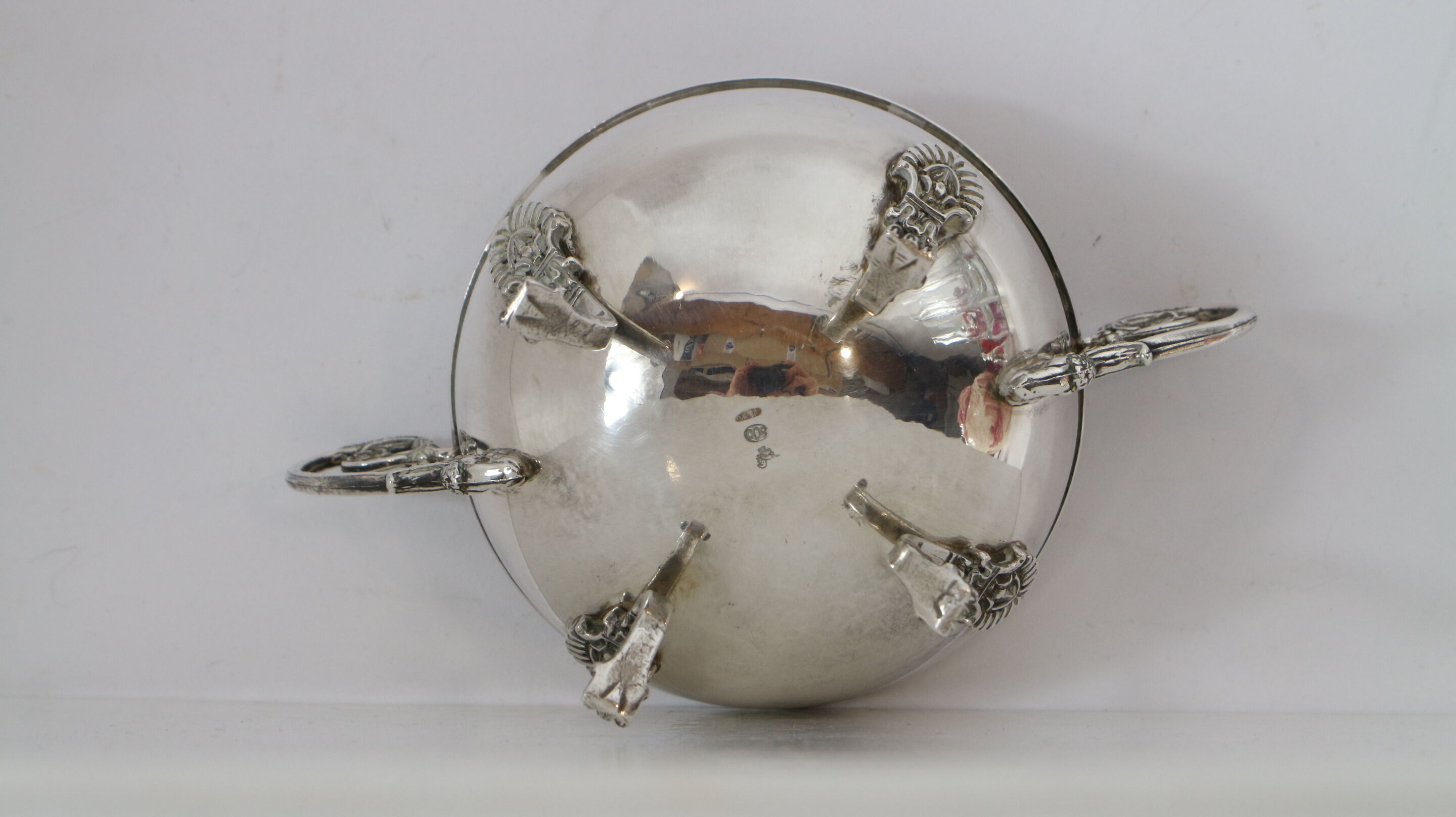 Silver sugar bowl with paw feet and ornate handles