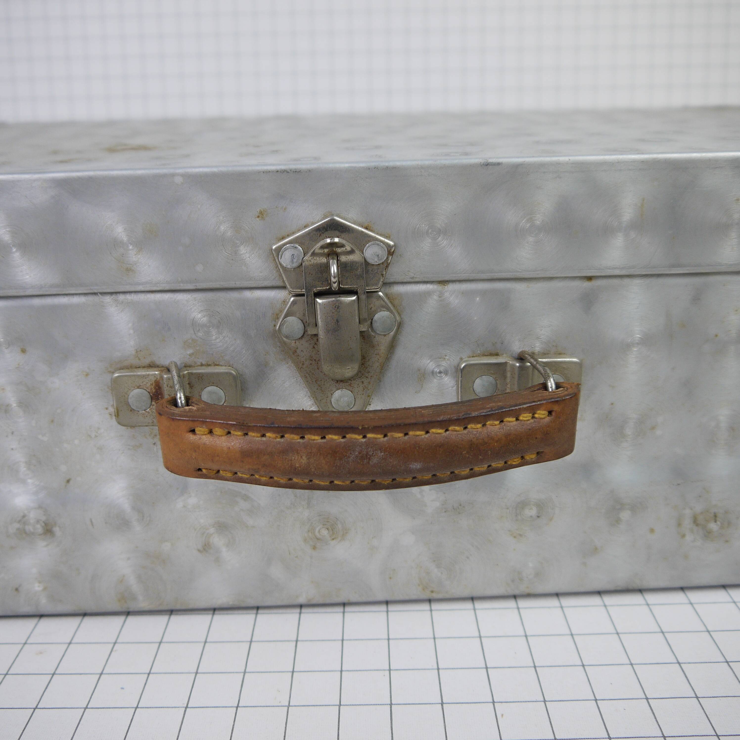 Metal case and leather handle