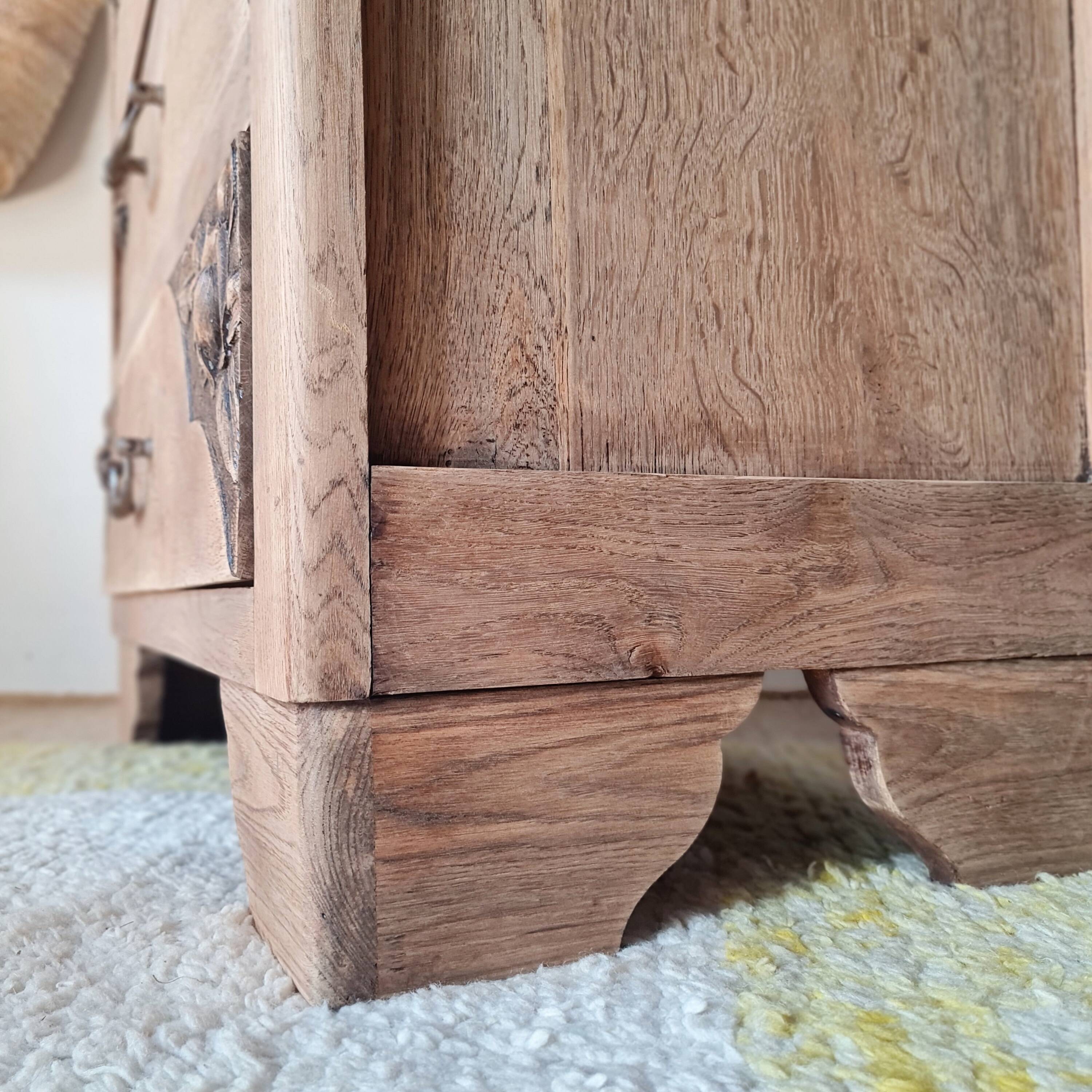 Art Deco chest of drawers in raw oak with carved drawers.