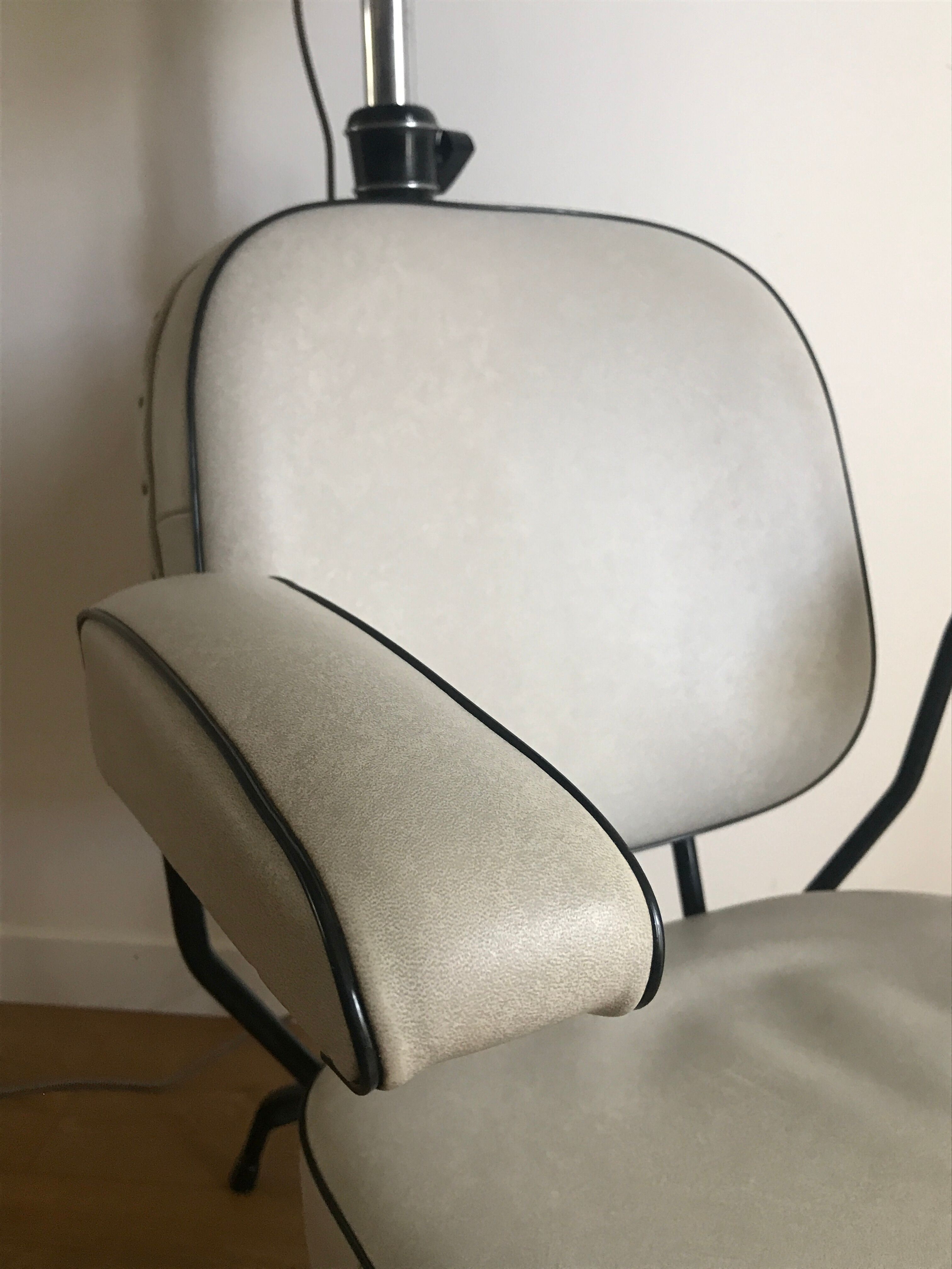 Vintage hairdresser's armchair with helmet transformed into a lamp