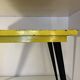 Table in the style of patinated yellow metal Tolix.