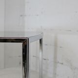 Living table. chrome metal, curved smoked glass slab, france, circa 1970.