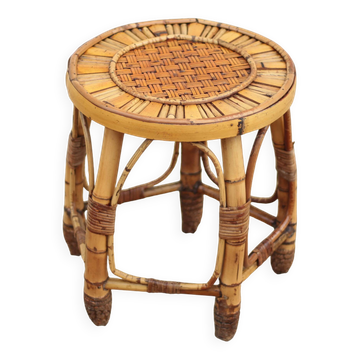 Vintage bamboo stool, woven rattan plant stand, interior decoration.