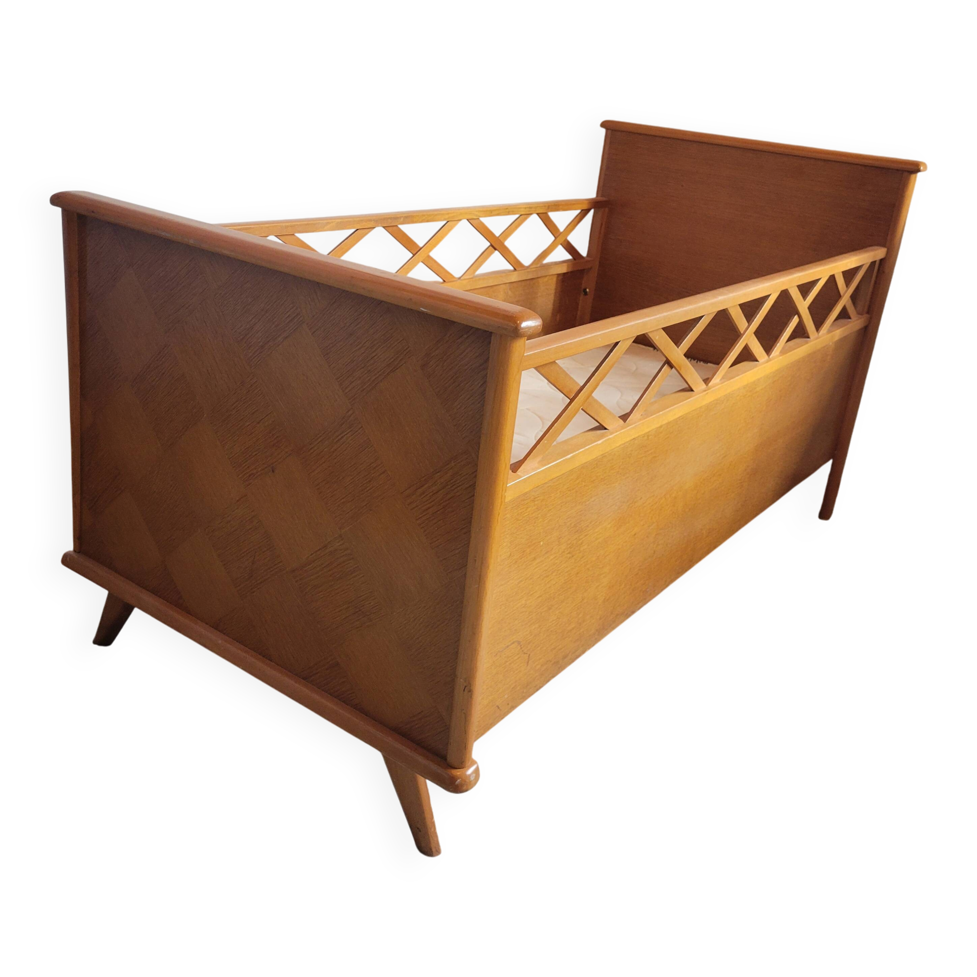 Vintage baby cot with splayed legs.