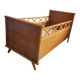 Vintage baby cot with splayed legs.