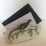 Letter door in earthenware topped with a peacock